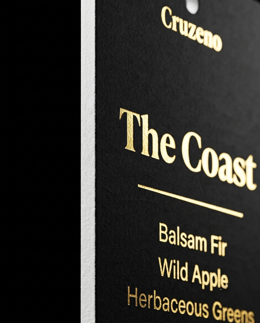 Black tag with gold text displaying 'The Coast' and product descriptions.
