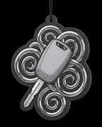 A novelty car air freshener or keychain charm featuring a gray car key in the center, surrounded by a black and silver cloud-shaped outline with swirling patterns, shown against a solid black background.
