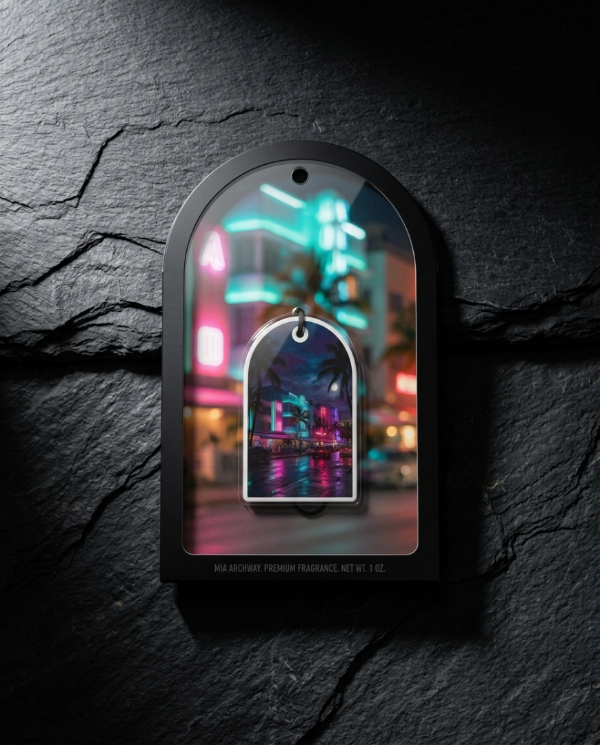 An arched black fragrance tag with a clear window displaying a miniature neon cityscape, mounted on a dark textured stone background.