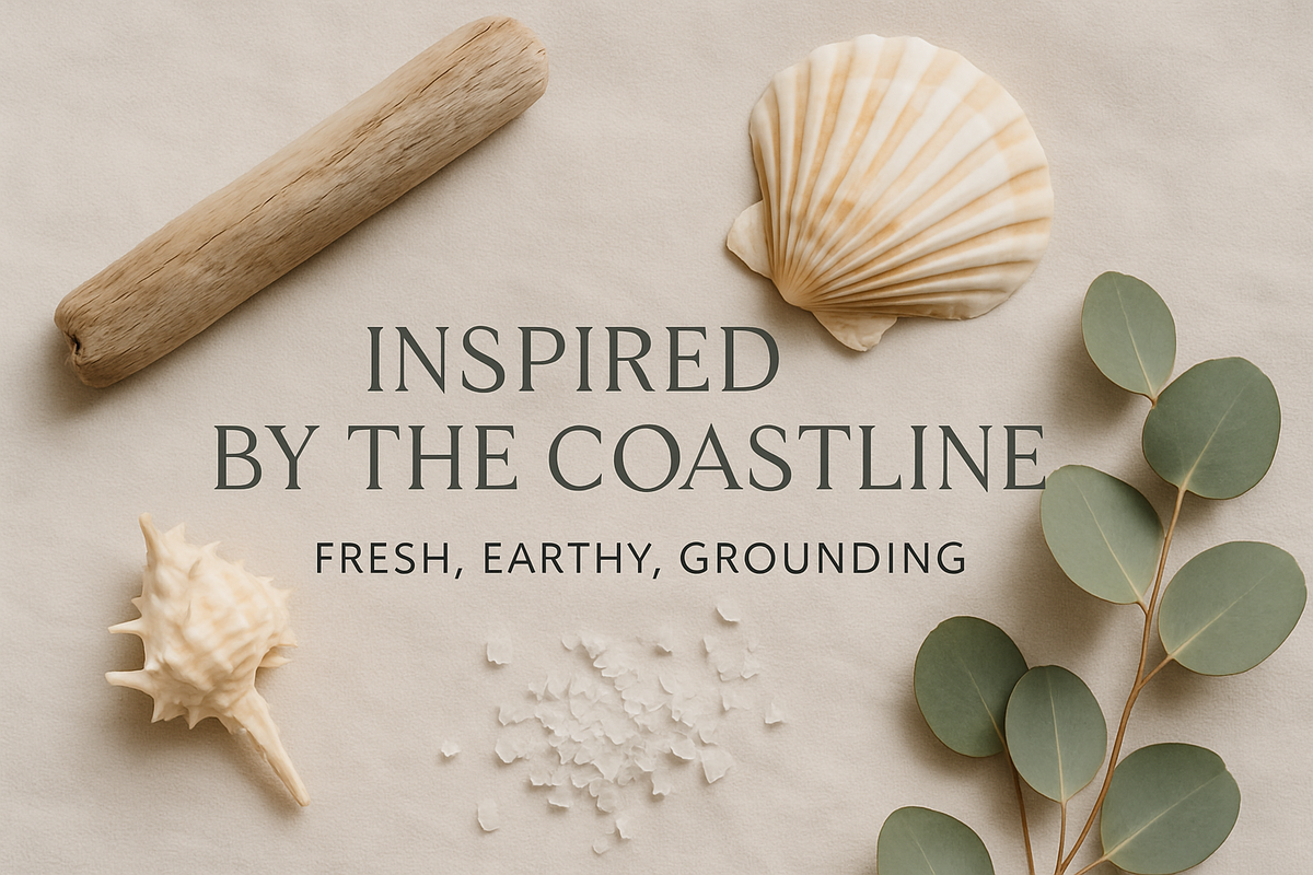 "Minimalist flat lay of seashells, driftwood, eucalyptus leaves, and sea salt crystals on soft beige fabric. Text overlay: ‘Inspired by the Coastline – Fresh, Earthy, Grounding.’ Clean, modern font in CRUZENO style."